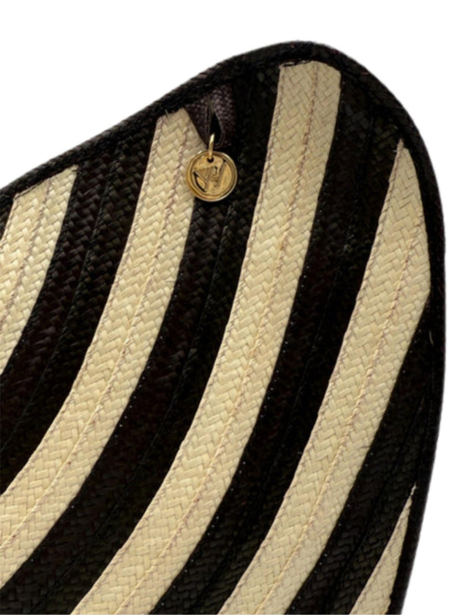 Handwoven palm leaf bag with artisan detailing