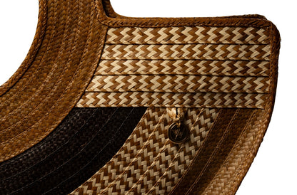 Handmade palm leaf bag with distinctive woven pattern