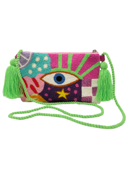 Crossbody clutch bag with handcrafted textile design