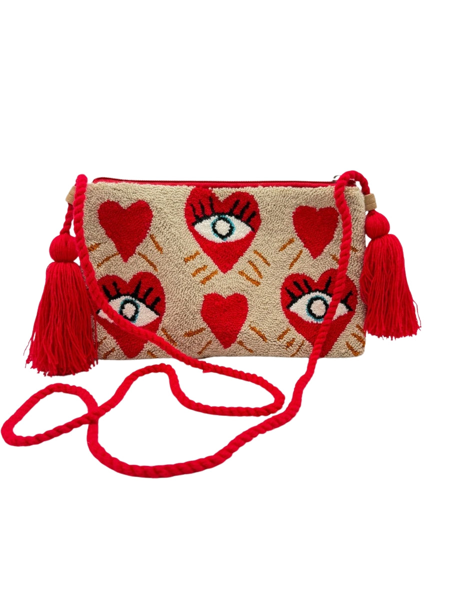Crossbody clutch featuring colorful evil eye detail