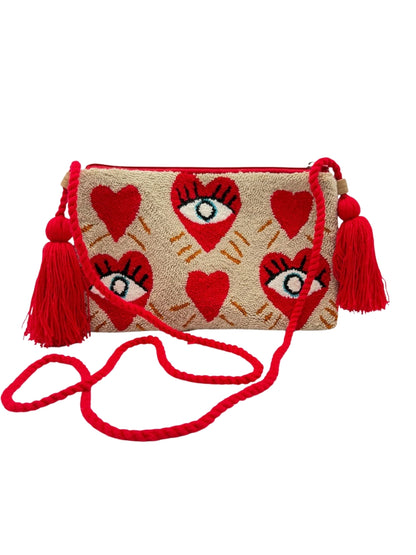 Crossbody clutch featuring colorful evil eye detail