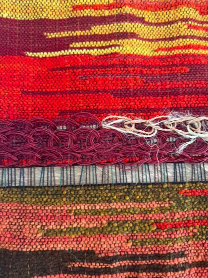 Handwoven artisan tapestry with earthy tones