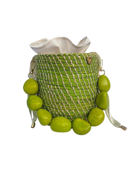 Handmade rattan bucket bag with natural palm weave texture