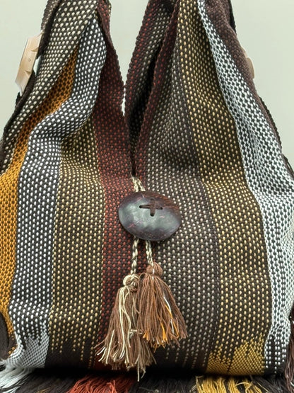 Artisan-crafted shoulder bag with traditional craftsmanship