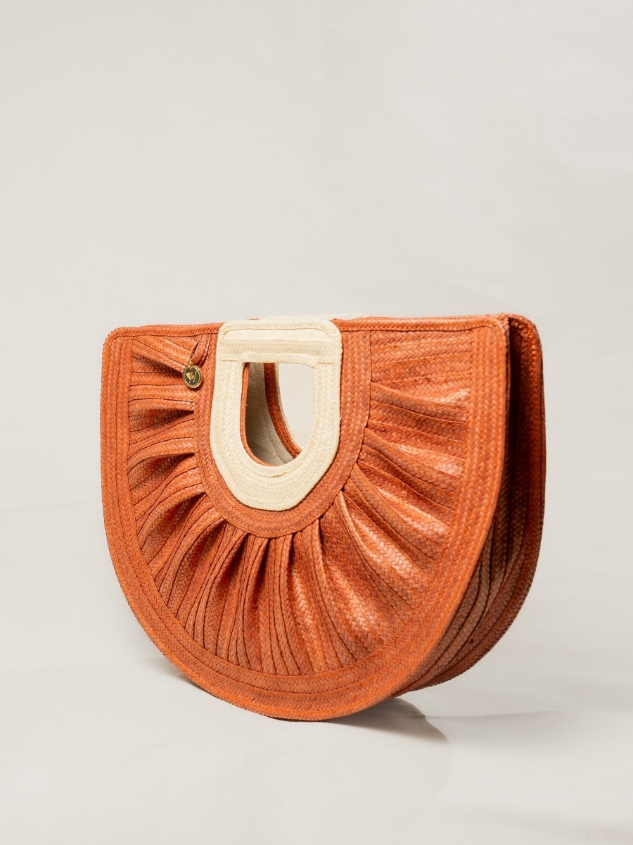 Handmade artisan palm bag with natural woven finish