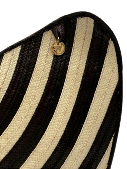 Handwoven palm leaf bag with artisan detailing